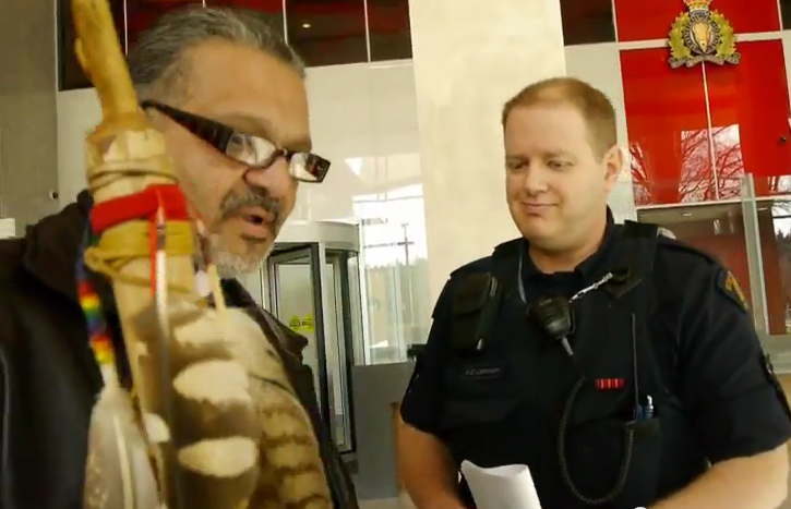 The grin on the RCMP officer's face is priceless...