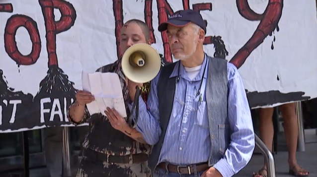 Iranian government ally Ken Stone holds the megaphone...