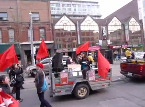 Sakura Saunders leading Marxist revolutionary chants at last year's May Day rally.