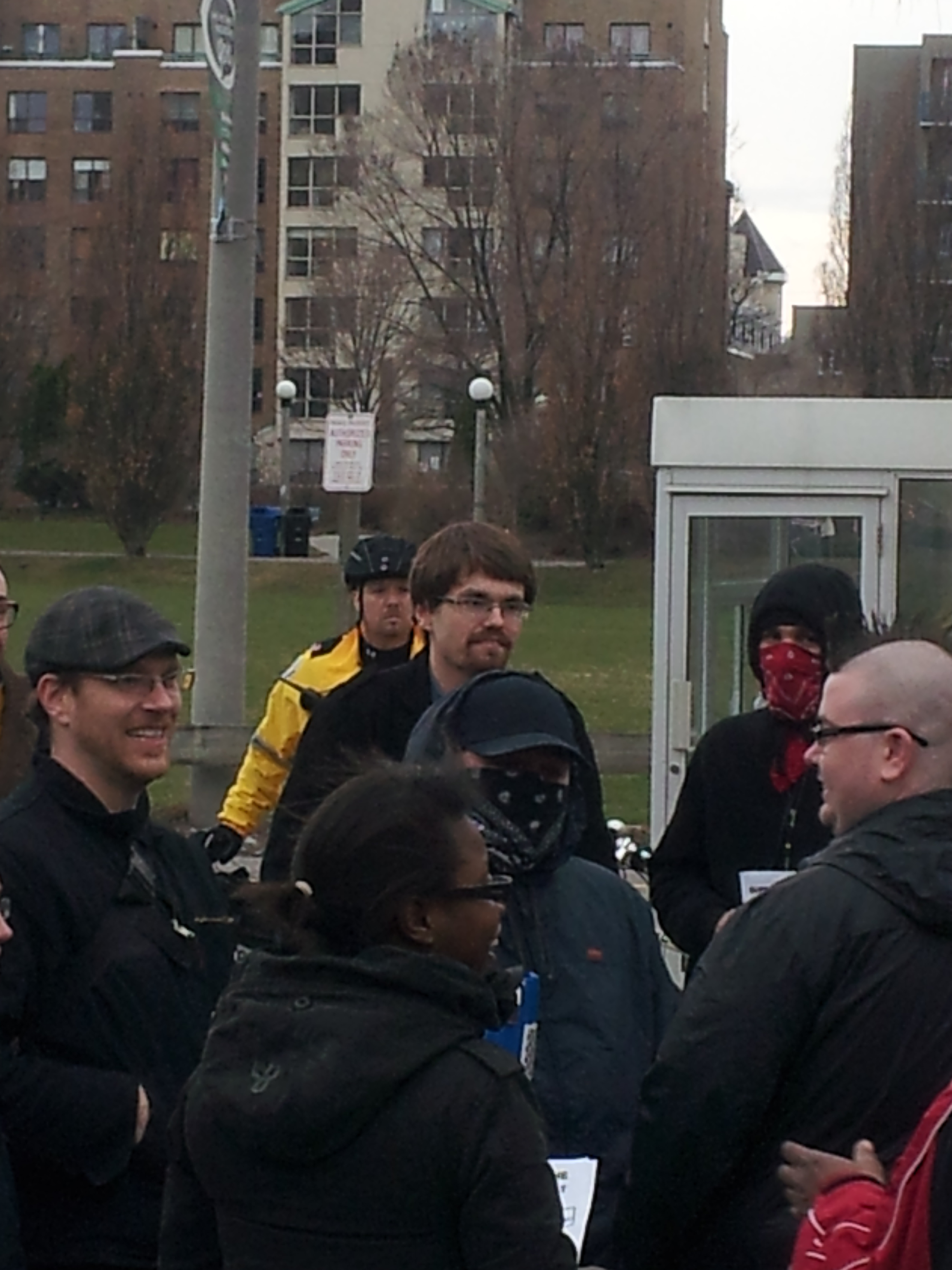 Steve Anderson of Rabble.ca (far left), Jared Anderson of York University SAIA (centre, behind masked anarchist)