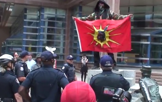 Gary Wassaykeesic (with flag) taunting the police...