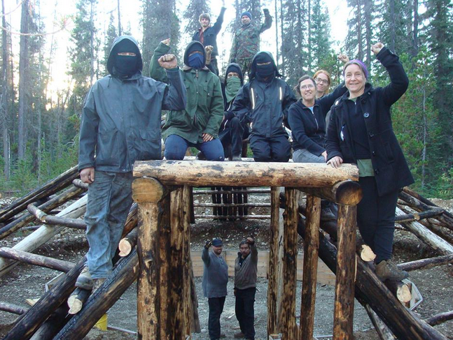 Zoe Blunt (far right) and anarchists build a structure on Crown land