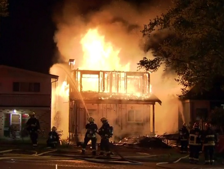 Firefighters working to put out the blaze...