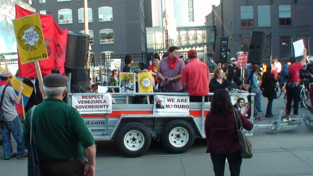 Alex Hundert & Sakura Saunders on a May Day float promoting the Venezuelan government...