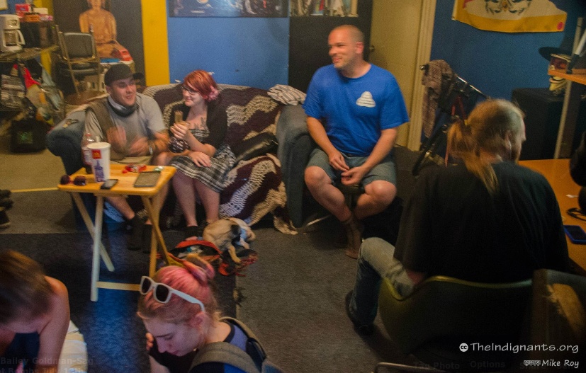 Bailey Lemon, , and Curtis Nixon (far left) at a Food Not Bombs meeting...