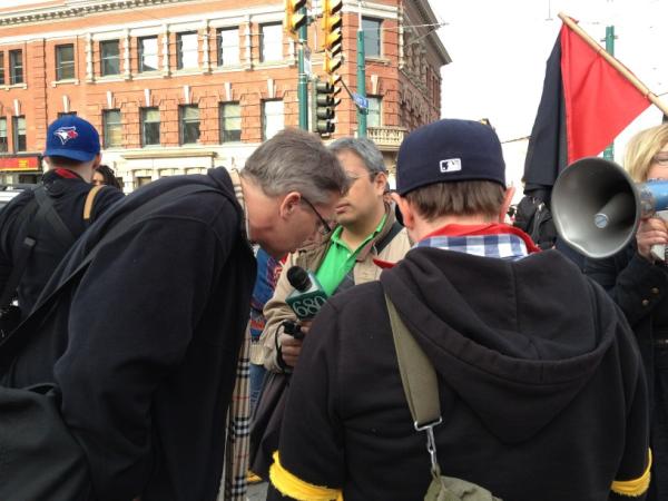 Greg Renouf being interviewed by 680 News At Toronto's May Day Parade...