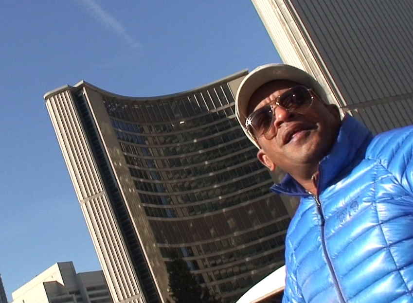 Who is the mystery man in the blue coat?