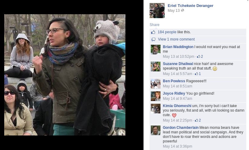 Conference organizer Eriel Deranger waving her fist...