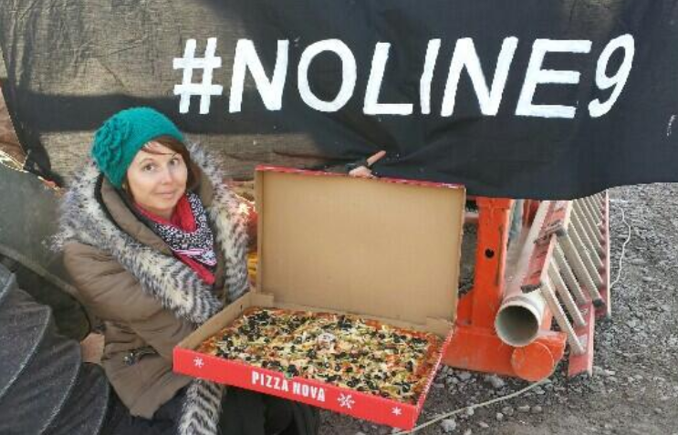 Taylor "Pottymouth" Flook showing off the pizza...