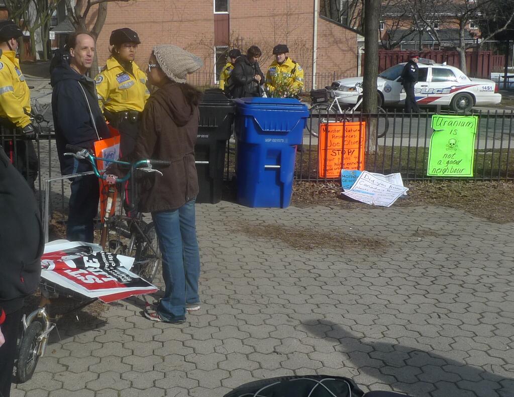 Sakura Saunders distributing Envorinmental Defence's Line 9 posters at a March, 2013 anti-police march