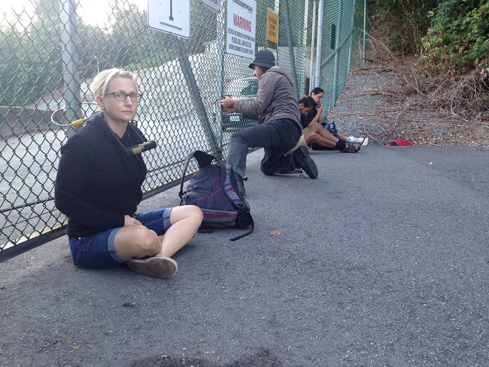 Mia "Gandhi" Nissen locked to gate at Burnaby Kinder Morgan property