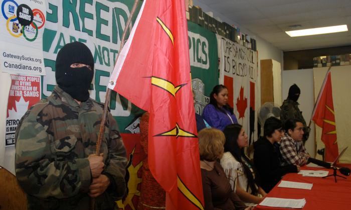 2010: Clayton Thomas-Muller (plaid shirt) with Eriel Deranger (black shirt) and violent racist thugs