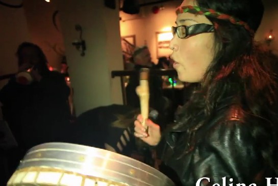 Audrey Siegl banding her drum...