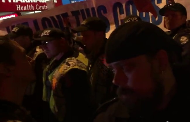 Dan Wallace (on left) with We Love This Coast sign in-back